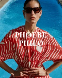 Model wearing dark sunglasses and a red and white patterned top beside a blue swimming pool