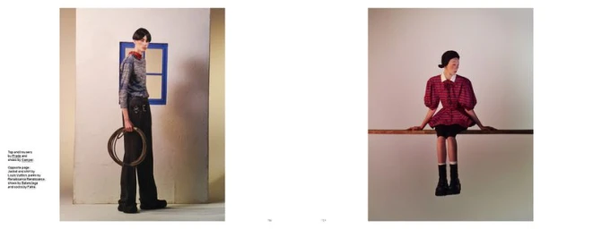Two-page fashion editorial spread featuring a standing model holding a coiled rope and a model seated on a narrow beam.