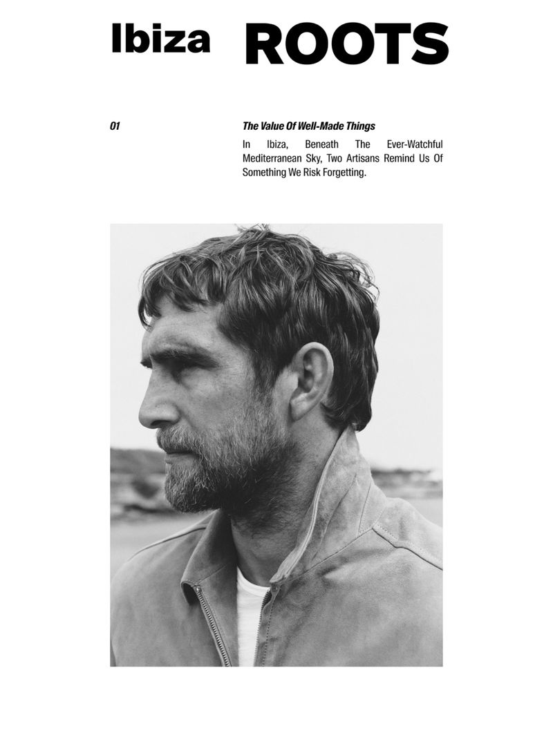 Monochrome portrait of a bearded adult male in profile wearing a collared shirt, captured outdoors with soft light and shallow depth of field.