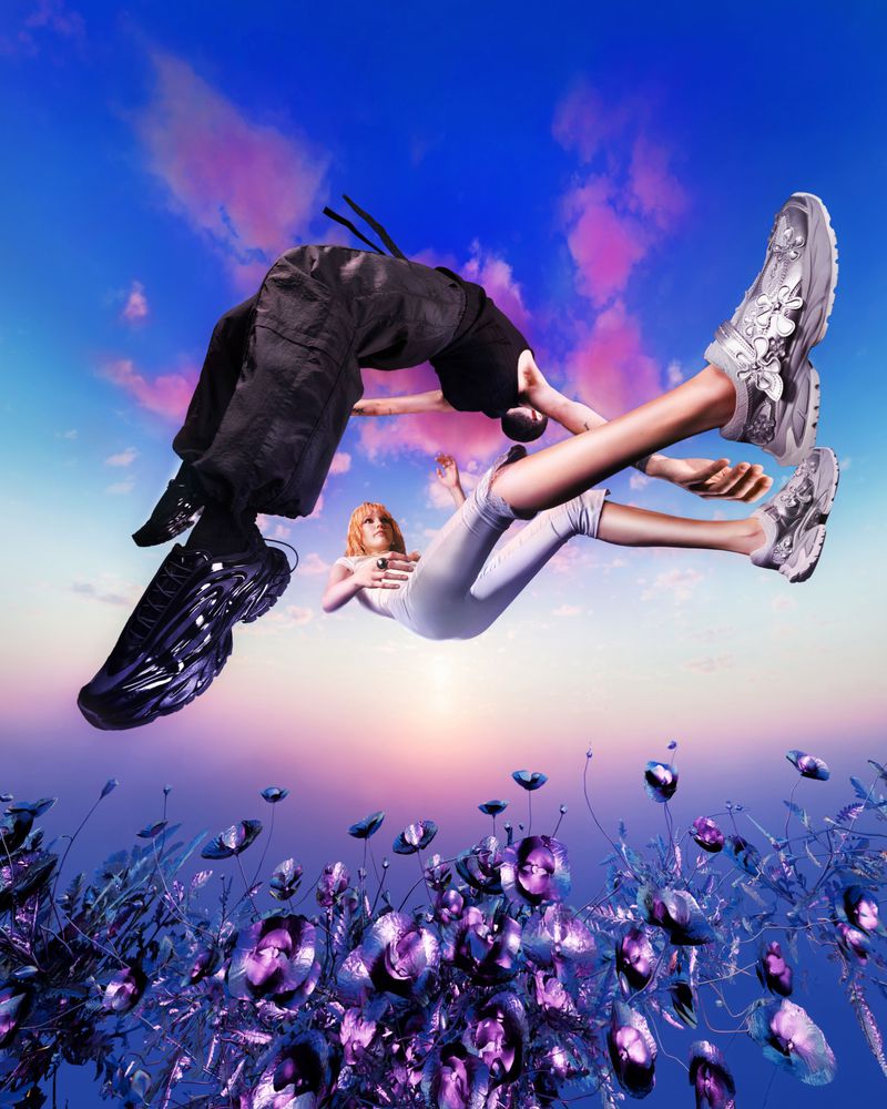 Two models floating in mid-air against a sunset sky above a field of metallic purple plants for Bershka