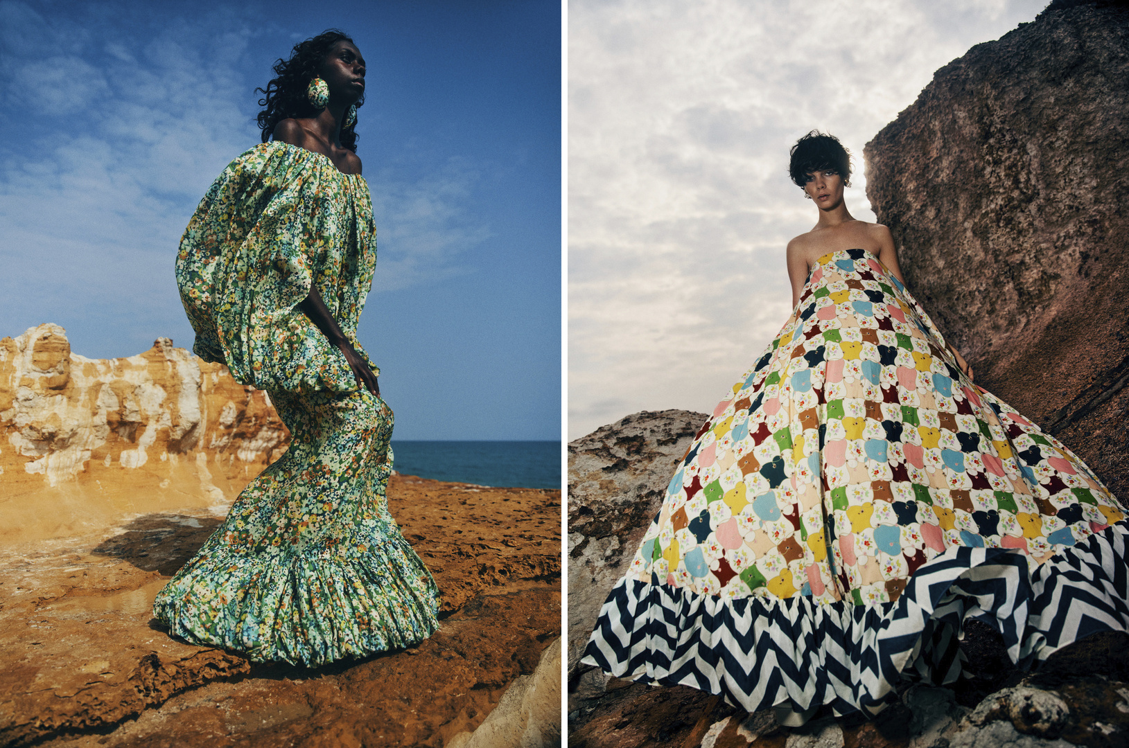 Two fashion models in long gowns pose on a rocky coastline under a cloudy sky and bright blue sky with ocean backdrop.
