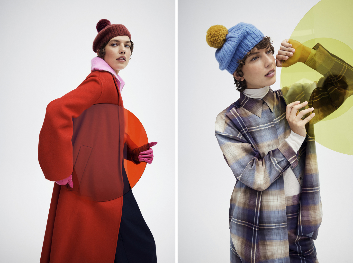 Two women wearing winter hats and colorful coats, posing on a white background with translucent orange and green circles.