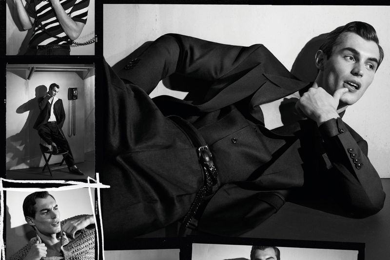Black and white film shot of a man in a suit posing. The shot includes a telephone and other images within the film frame.