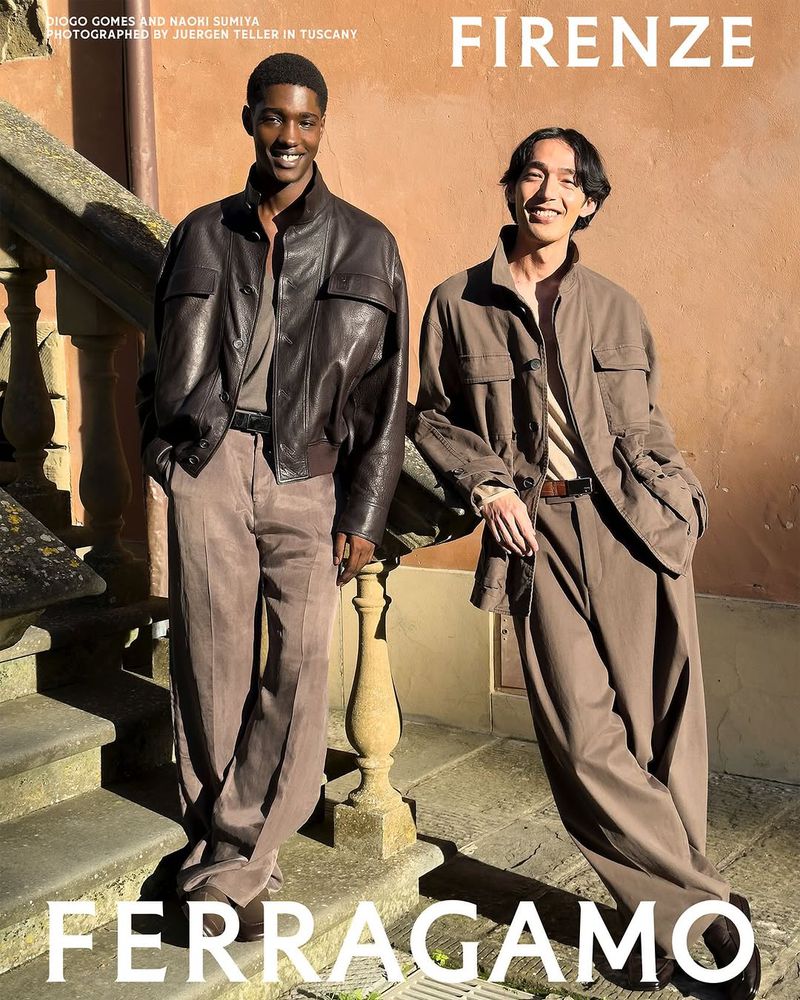 Two fashion models in brown jackets and pants pose on stone steps in Florence, Italy for Ferragamo, captured in a medium outdoor shot.
