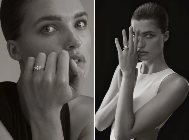 Monochrome portrait of a woman showcasing an engagement ring, set against neutral and black backgrounds, emphasizing beauty and elegance.