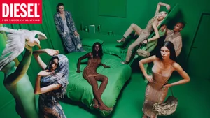 Group of models in a monochromatic green room featuring a bed, styled in Diesel campaign apparel by photographer Frank Lebon