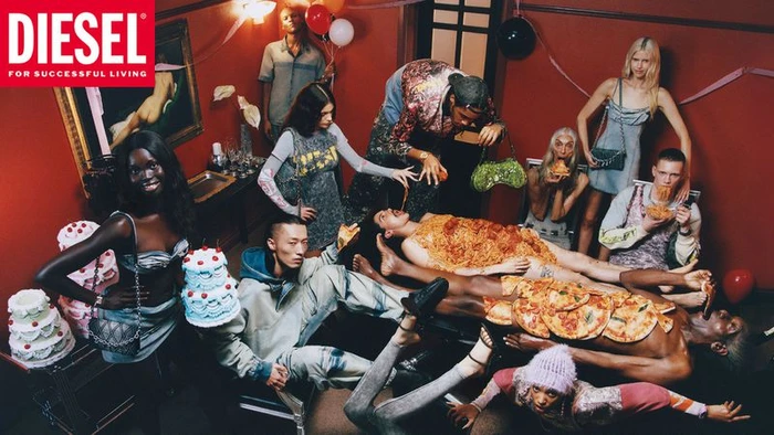 Group of models in a red-walled room with cakes and pizzas, for Diesel S/S 2025 campaign by Frank Lebon