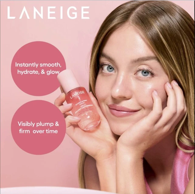 Close-up shot of a woman holding Laneige serum. Her skin is clear and radiant, on a pink background with product details.