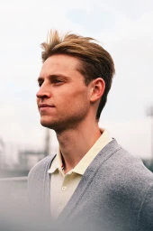 Frenkie de Jong in a grey Thom Browne cardigan and polo shirt for FC Barcelona