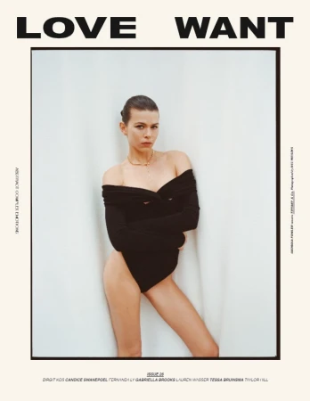 Georgia Fowler wearing a black off-the-shoulder bodysuit against a plain white studio background for Love Want magazine.