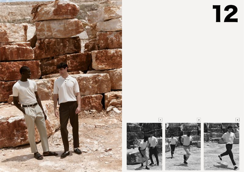 Two men pose in neutral-toned casual wear against a background of stacked rock formations under natural light, with a modern fashion editorial aesthetic.