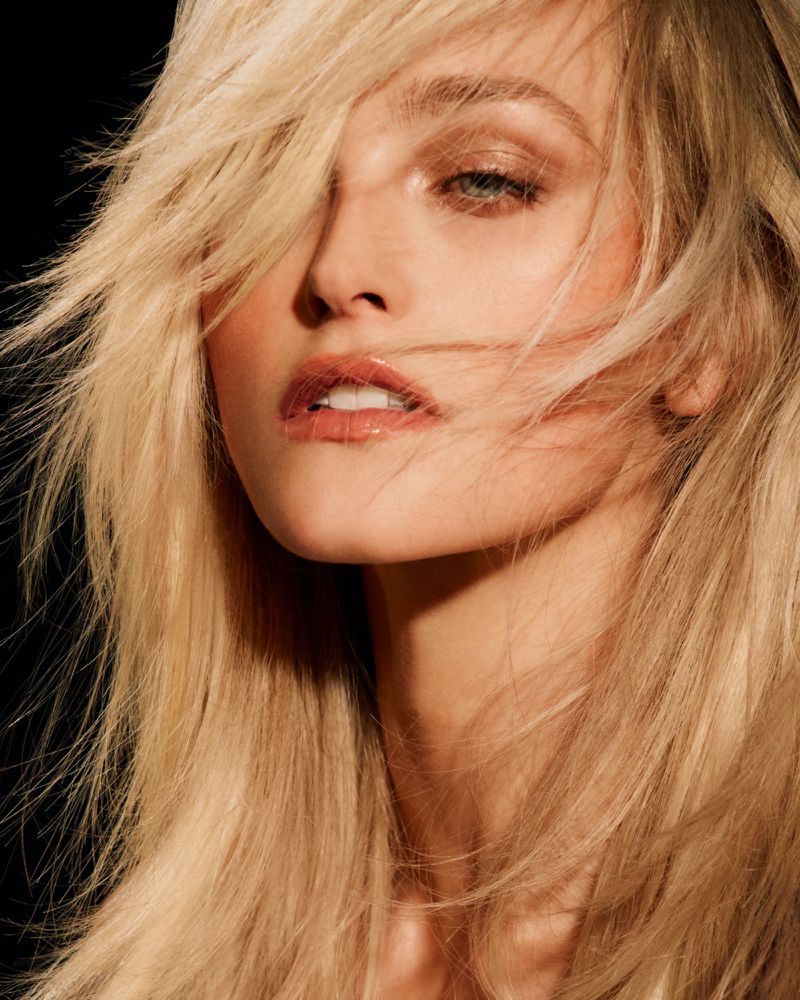 Close-up portrait of a blonde woman with loose hair framing her face for 16Arlington spring summer 2025 campaign