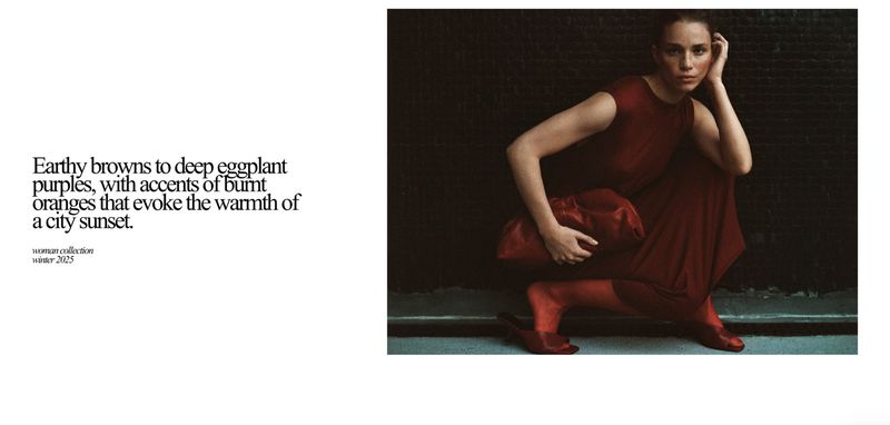 A woman in a red dress is captured in a dimly lit fashion shot. She is crouching with a matching red bag, set against a dark background.