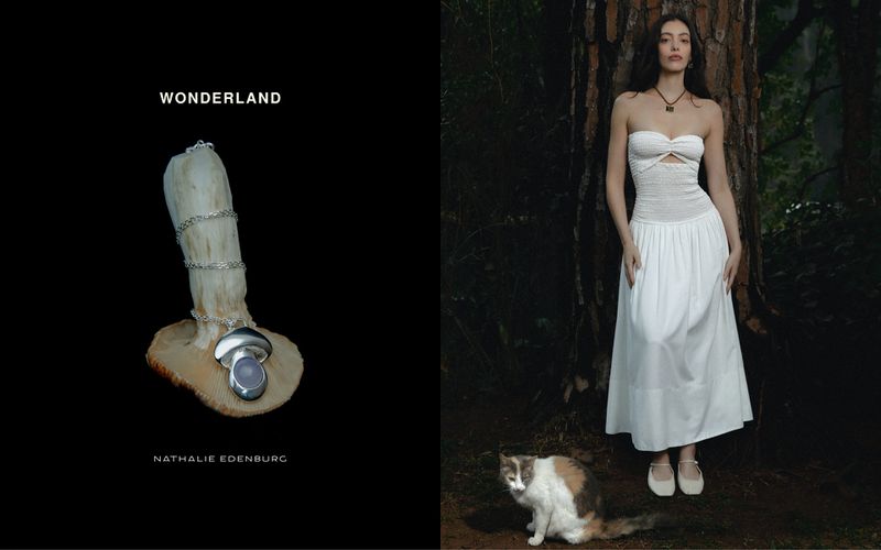 Artistic jewelry product shot contrasts a silver necklace with a mushroom, against a model in a dress posing in a forest with a cat.