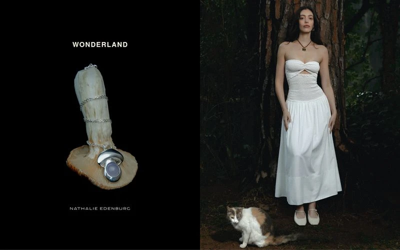 Artistic jewelry product shot contrasts a silver necklace with a mushroom, against a model in a dress posing in a forest with a cat.