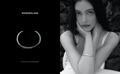 Black and white portrait of a woman resting chin on hands wearing a silver bangle bracelet