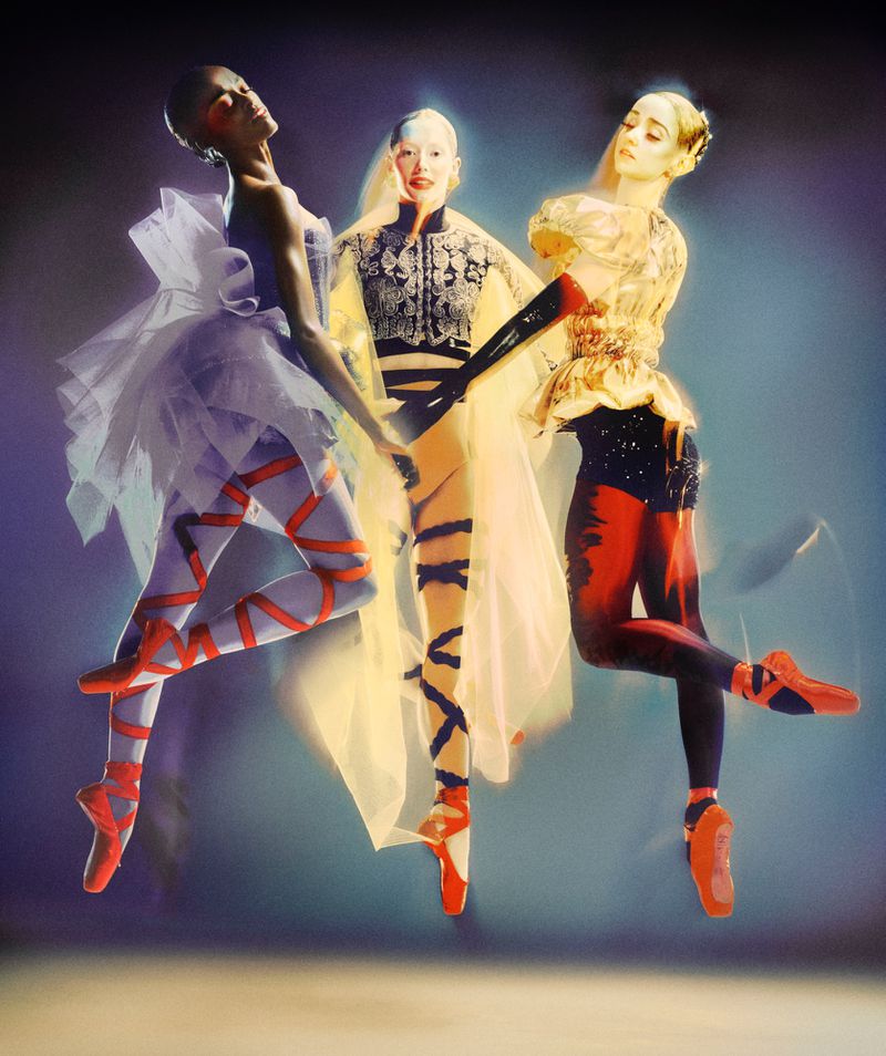 Three ballet dancers strike dynamic poses in colorful costumes and pointe shoes, captured in motion with a dreamy, soft focus and studio lighting.