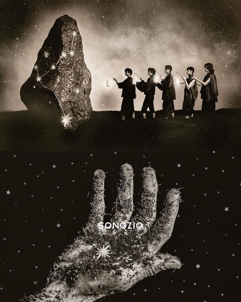 Artistic image featuring a group of people with lanterns next to a large rock formation under a star-filled sky and a hand covered in dirt.