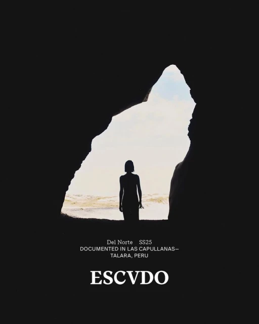 Woman silhouetted in cave entrance overlooking ocean under daylight sky. Dark cave opening contrasts with bright seascape beyond.