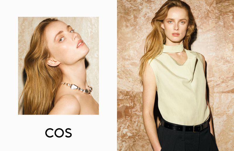 Model Rianne Van Rompaey wearing a light green sleeveless top and black trousers for the COS spring summer 2025 campaign.