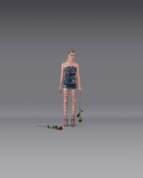 Model standing against a grey seamless background holding a red rose for Dsquared2 Spring Summer 2025 campaign photographed by Andrea Artemisio.