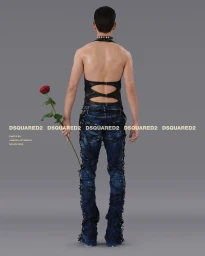 Man from behind wearing a black cut-out top and denim jeans wrapped in dark cords while holding a single red rose