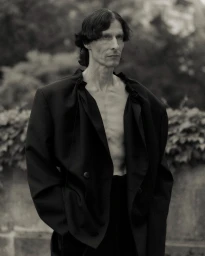Antti Kettunen wearing an oversized black blazer for Vautrait Spring/Summer 25 campaign photographed by Dudi Hasson.