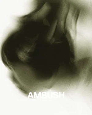 Abstract motion-blurred portrait featuring shadowed human forms against a pale background with visible AMBUSH branding.
