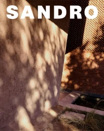 Text overlay reading SANDRO over a textured terracotta wall with dappled sunlight casting abstract patterns