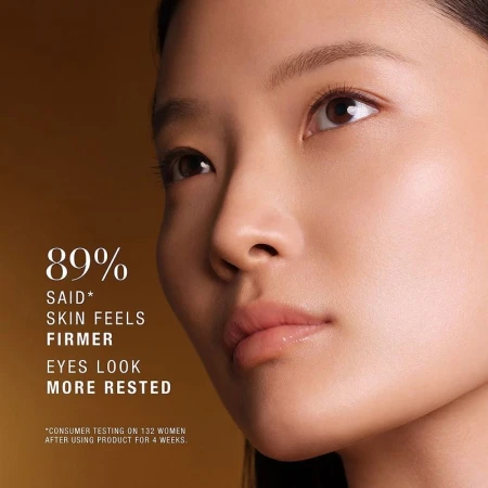 Close-up portrait of an East Asian model with luminous skin against a warm golden brown background with overlaid white text.