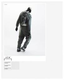 Model from behind wearing grey crewneck sweatshirt and matching sweatpants against a white studio background