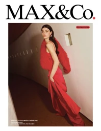 Model in red dress and fluffy red boa walking along a corridor for MAX&Co. Pre Collection S/S 2025