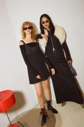 Two female models in black outfits and sunglasses posing indoors for MAX and Co pre collection spring summer 2025 campaign.