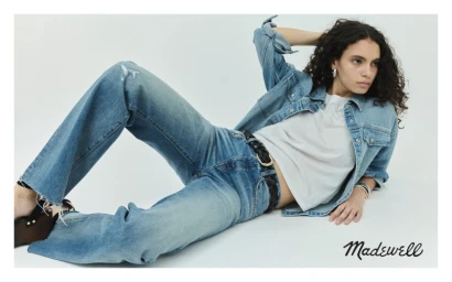Model Luma Vitoria in denim jacket and jeans posing against a white background for Madewell project Dean Easy