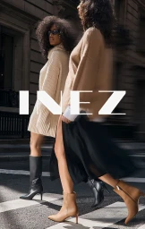 Two models walking across a city street crosswalk wearing knit sweaters and boots for Inez Fall 2024 campaign