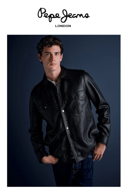 A young adult male poses in a black leather jacket and jeans against a dark blue background, highlighted by the 'Pepe Jeans London' logo.