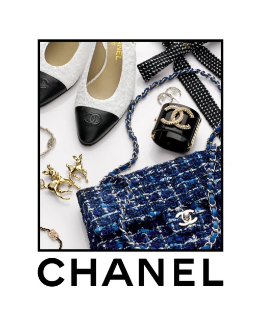 Fashion still life: Chanel handbag, shoes, and accessories on a white surface, framed by a black border and logo.