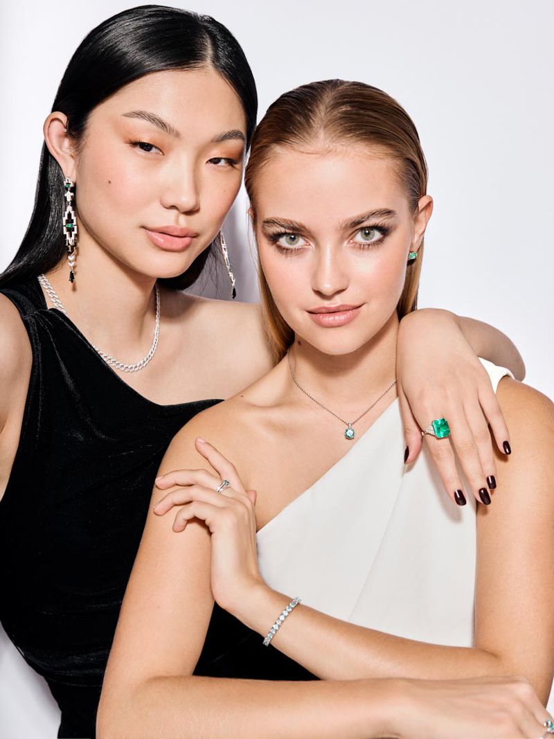 Two female models wearing fine jewellery and elegant dresses against a plain white background for VON KOCK project