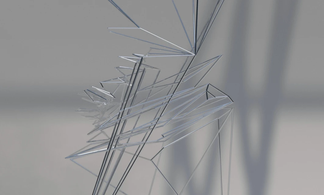 Abstract silver metallic structure with geometric shapes and lines against a gray background, creating a modern and minimalist design.