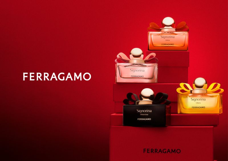 Ferragamo Signorina Libera fragrances in a studio shot on a red background, showcasing the product and brand for beauty or fashion.