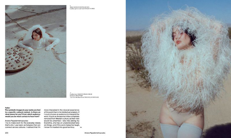 Fashion editorial with a woman emerging from a manhole cover and a woman in a feathery outfit in a desert landscape.