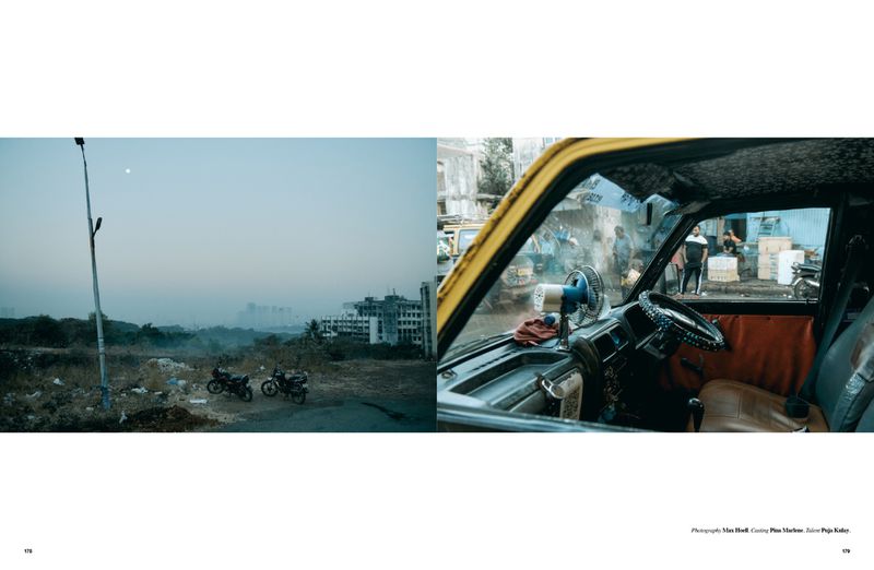 Urban landscape view split between a vehicle interior with a fan and the exterior with parked motorbikes and buildings under hazy sky.