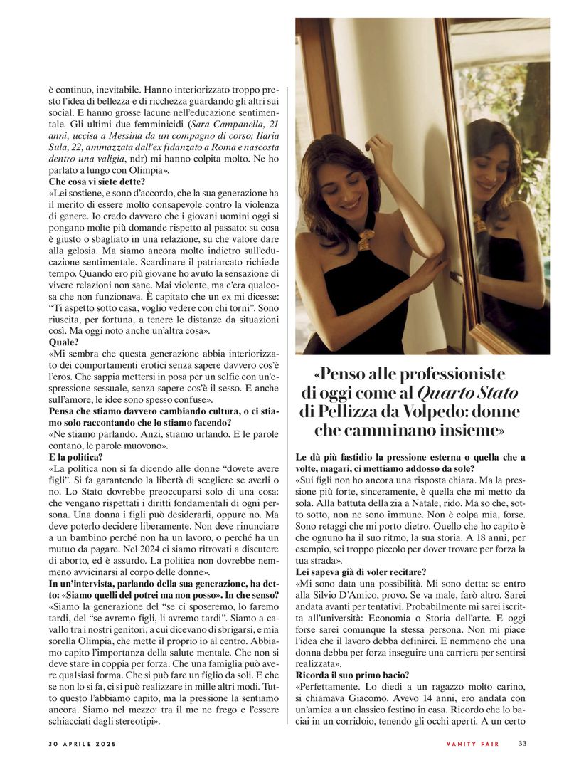 Magazine page layout featuring a portrait of a smiling woman posing in front of a framed mirror in Vanity Fair Italia.