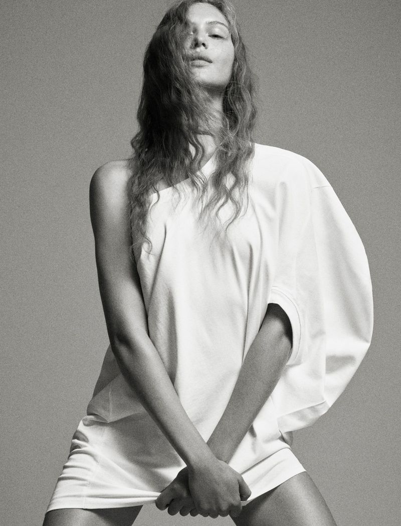 Model Angelina Kendall in a white t-shirt for Middle Plane Magazine, photographed by Mark Kean against a grey backdrop.