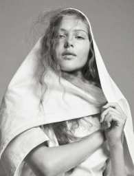 Model Angelina Kendall wearing a white t-shirt pulled over her head in a black and white editorial portrait by Mark Kean.