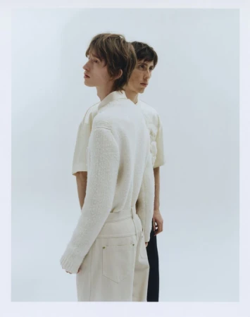 Two male models posing against a white studio background for The Greatest Magazine by photographer Johannes Brauner.
