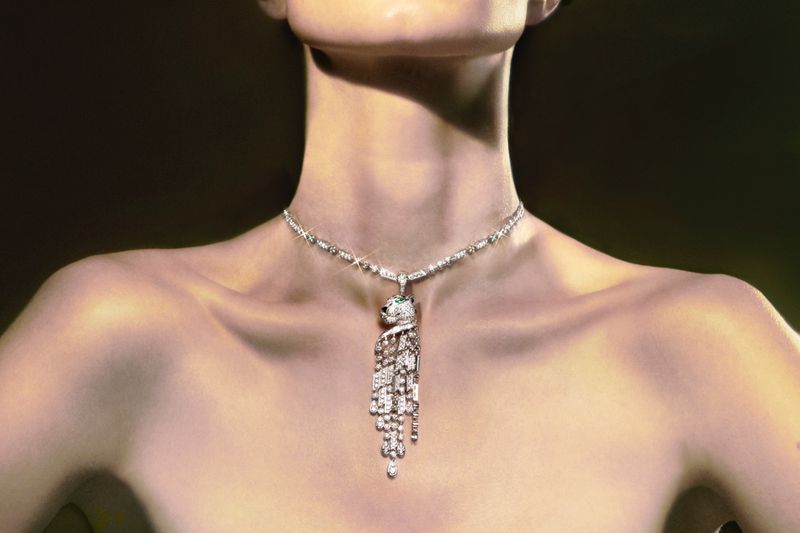 Model showcasing a diamond necklace with a panther pendant. Upper body shot in a studio setting with a dark background.