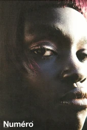 Close-up portrait of model Alek Deng with dramatic lighting and purple-toned eye makeup for Numero Netherlands editorial