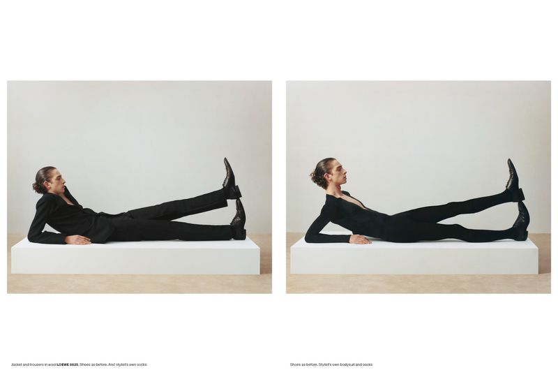 Two side-by-side frames of a male model posing on a white platform wearing a black suit and black bodysuit
