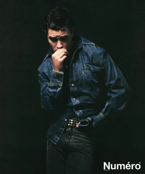 Model Francisco Lachowski wearing a blue denim shirt against a dark background for Numéro Homme Netherlands editorial.